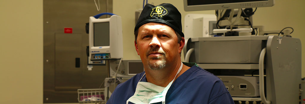 Dr. Garramone wearing scrubs ready to consult with patients Colorado Orthobiologics Regenerative Medicine Castle Rock CO